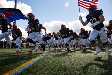 Football players hit the field.