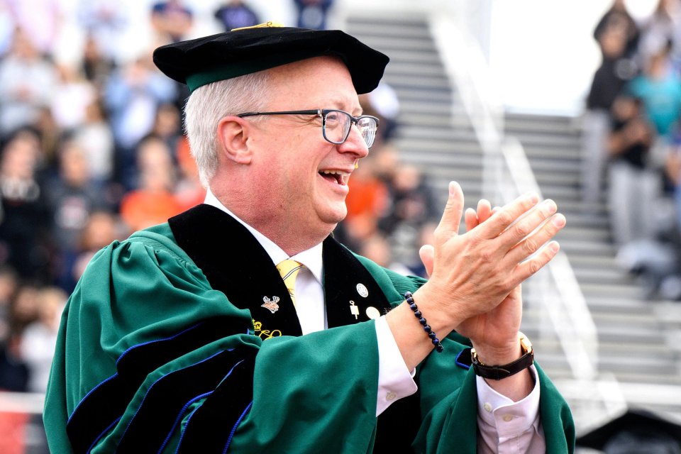 President Todd Pfannestiel clapping with the crowd at his Fall 2023 inauguration.